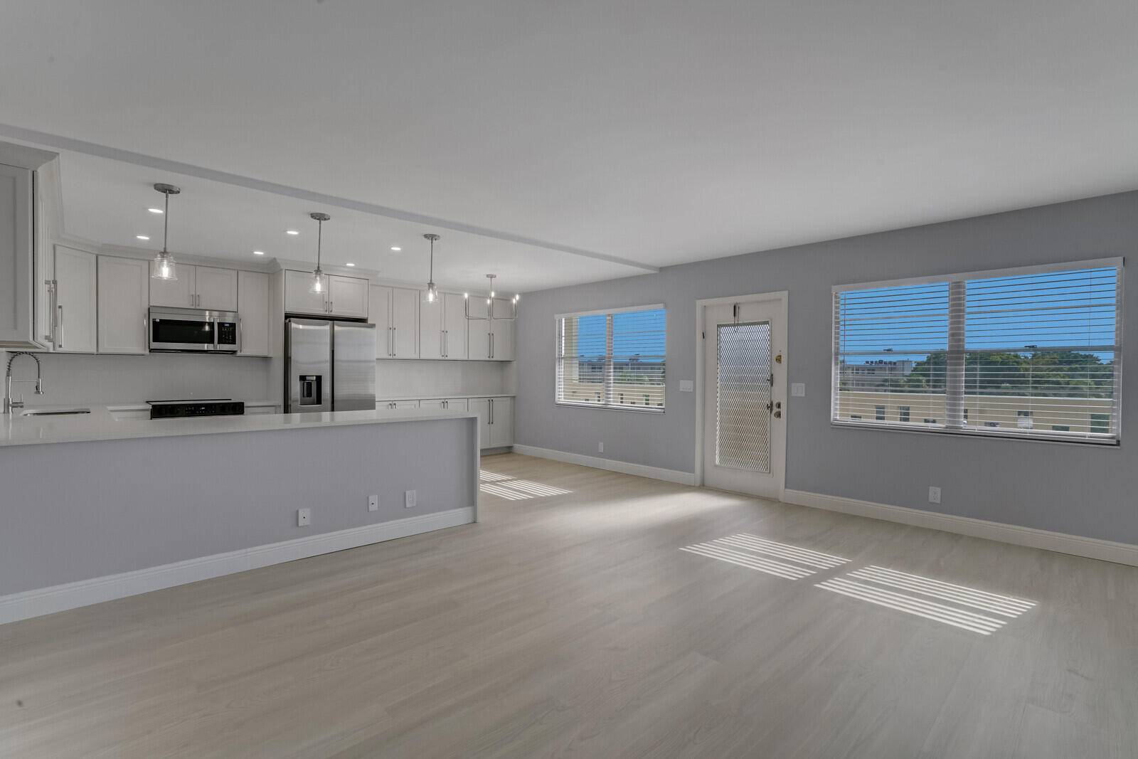 Enjoy incredible lake views from this gorgeously remodeled penthouse unit in Ainslie.