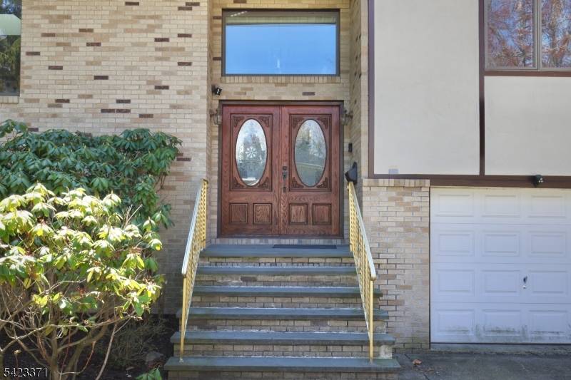 Spectacular brick bi level residence, masterfully crafted in the 1990s and offering over 3, 600 square feet of refined interior living space.