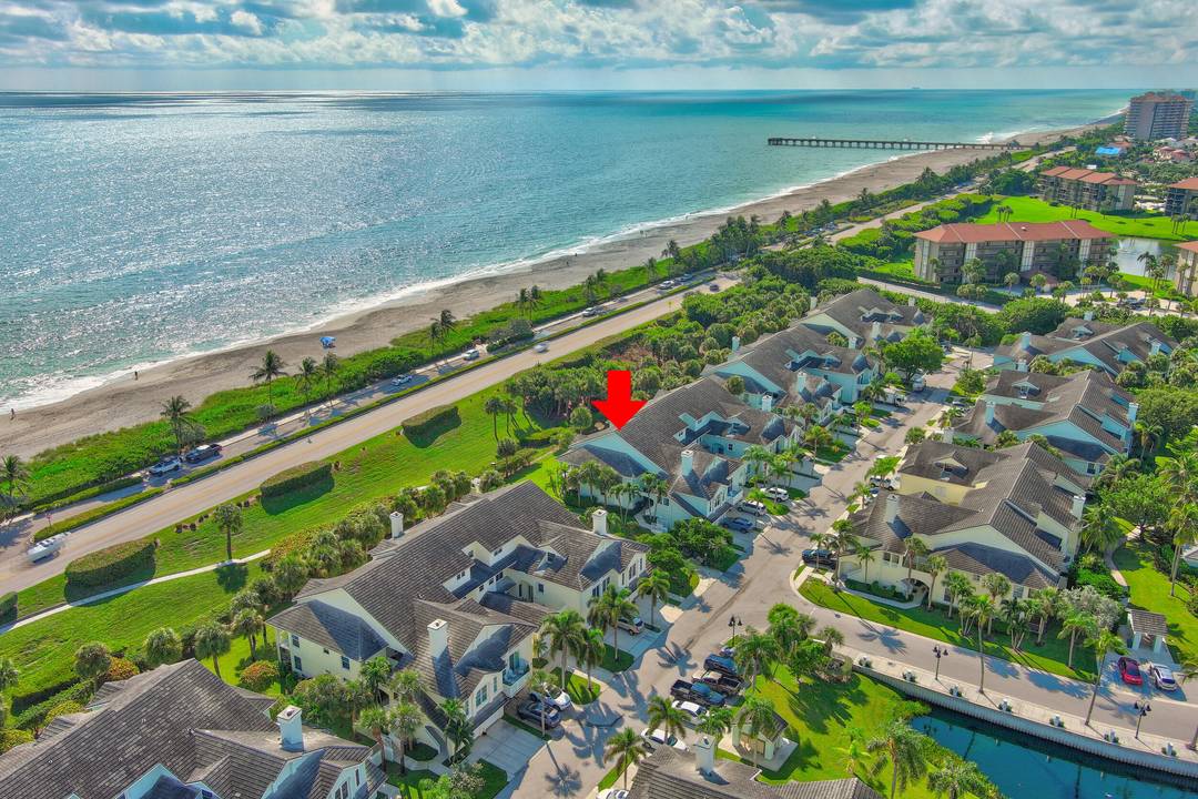 Discover paradise in this beautiful, DOG FRIENDLY Sea Colony condo with OCEAN VIEWS JUST STEPS from JUPITER'S PRESTINE BEACH.