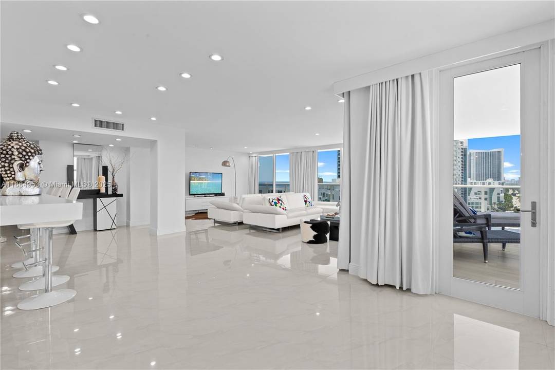 Wake up to stunning ocean and bay views from every room in the largest penthouse in the community.