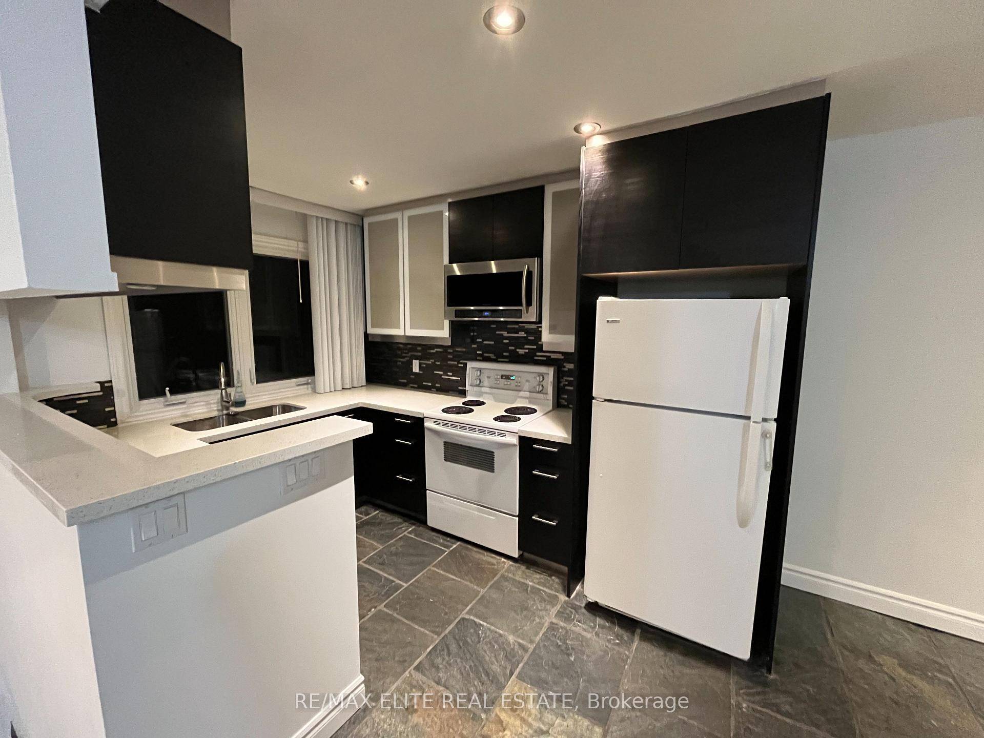 L Shape property. Main Unit including the upper floor and basement.