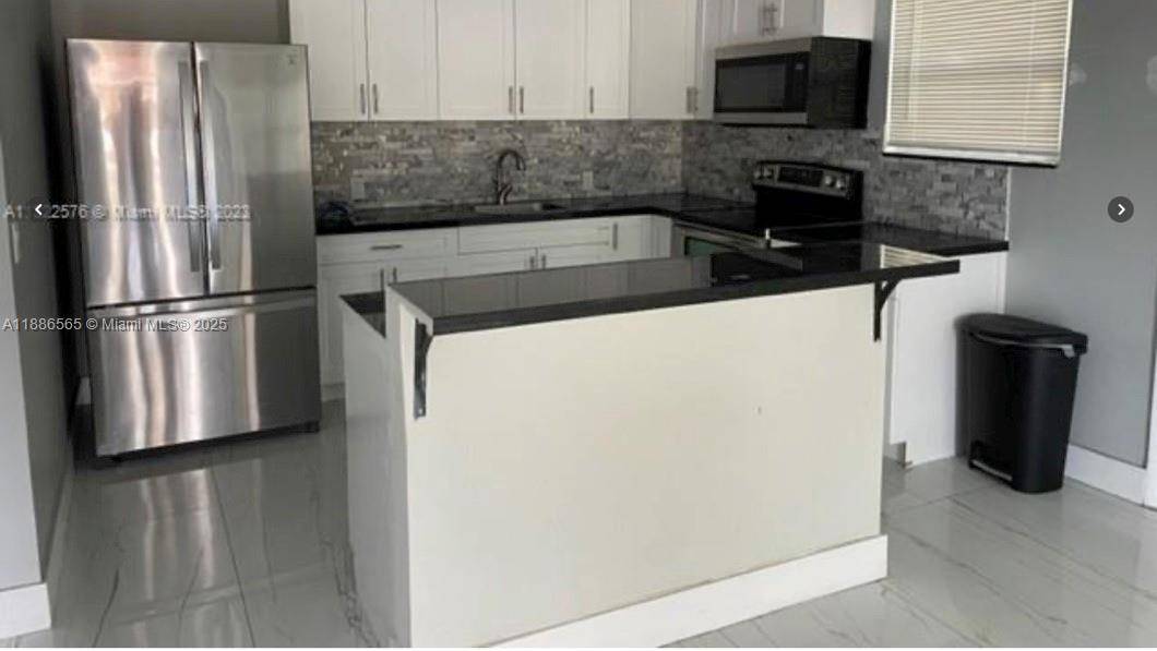 Beautiful completely renovated 4 bedroom 3 bath Single Family home, features new kitchen with stainless steel appliances, modern cabinets and granite countertops, remodeled bathrooms, Central A C units, Water Heater, ...