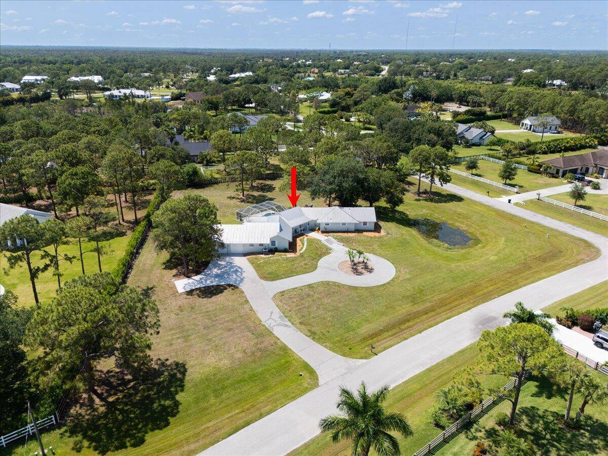 Welcome to 10006 SW Tyler Terrace, located in the highly desirable gated community of Stuart West in Palm City.