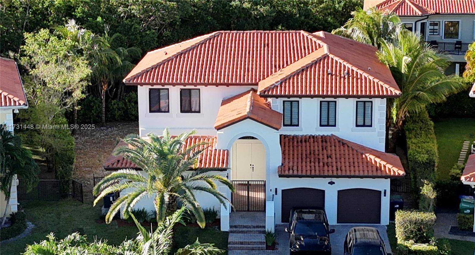 Step into this beautiful, fully renovated five bed, five bath home, a modern masterpiece in a covered South Florida guard gate community.