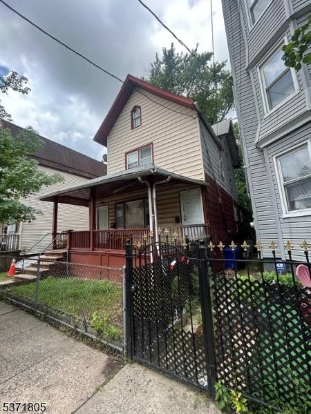 Sold as is. Large 2 Family home with private driveway.