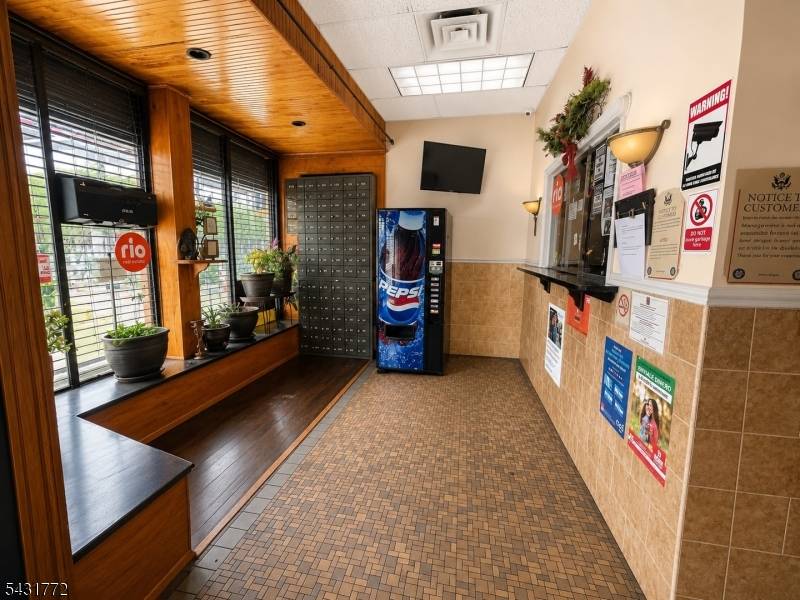 Mixed use investment opportunity featuring a main floor commercial space and two spacious 2 bedroom apartments above, both offering stunning views of Jersey City.