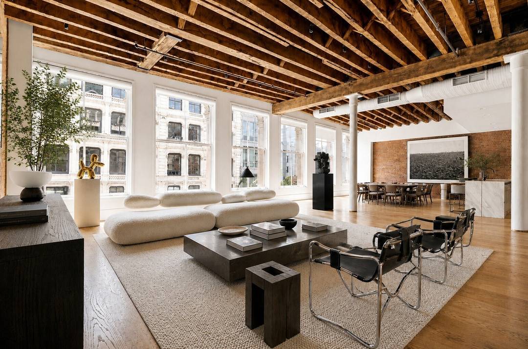 A rare full floor loft in one of SoHo s most discreet and architecturally significant boutique condominiums.