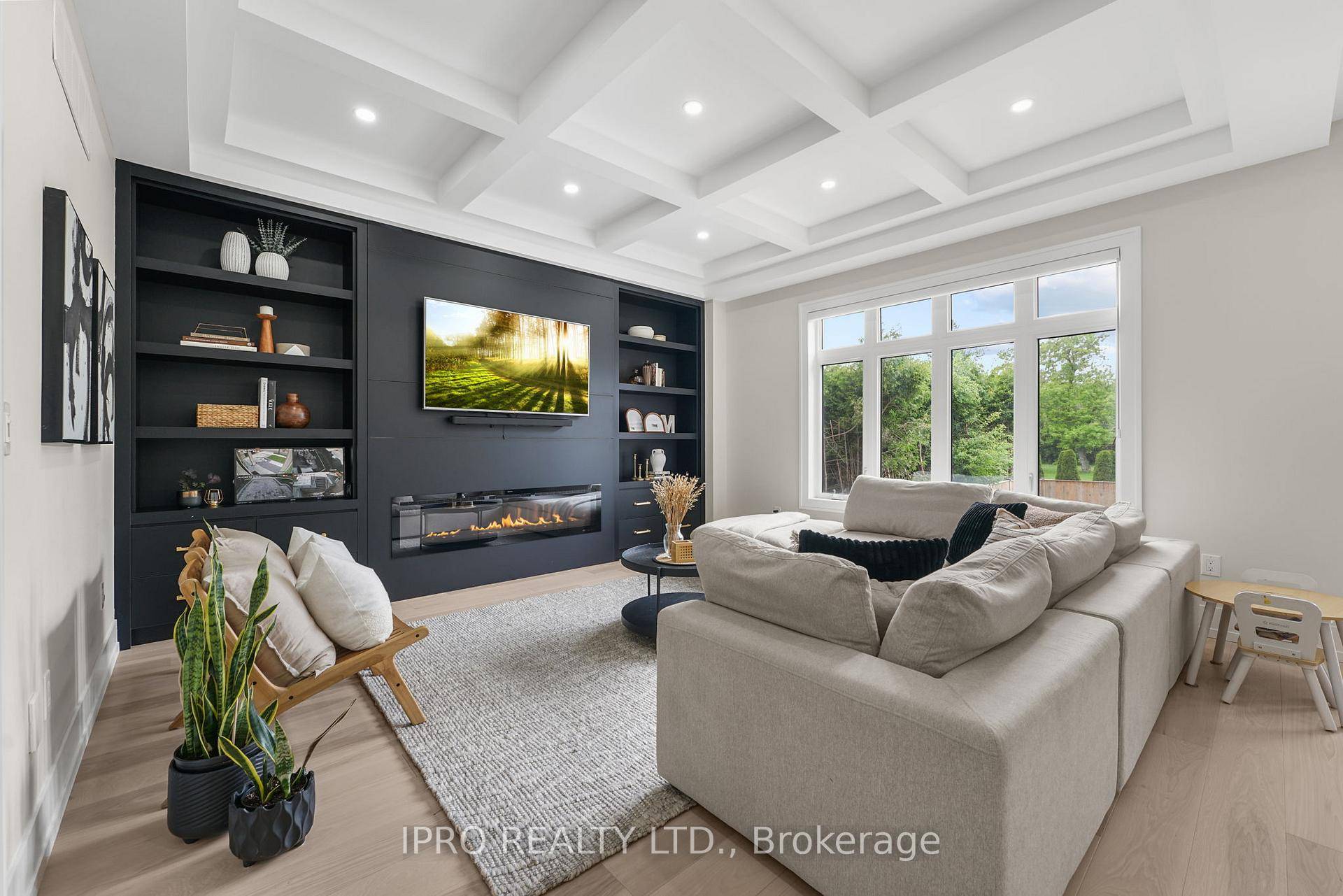 Experience luxury in this modern Willowdale West residence, showcasing a chefs kitchen with a waterfall island, custom cabinetry, and high end appliances.
