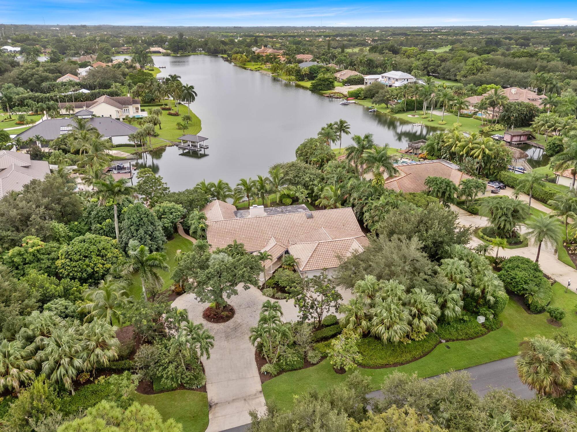 It's here ! Your private lakefront retreat located on just over 1 acre in the prestigious community of Banyan Lakes.