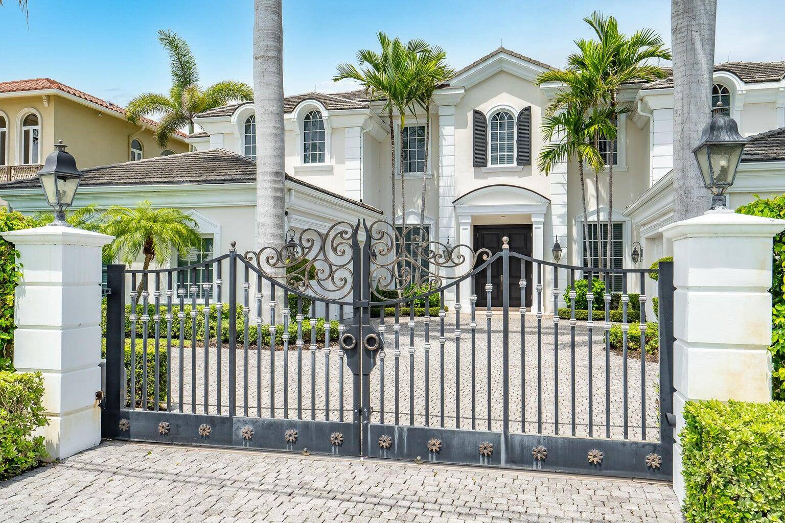 Welcome to this extraordinary private, gated waterfront estate, nestled within Boca Raton's most prestigious enclave.