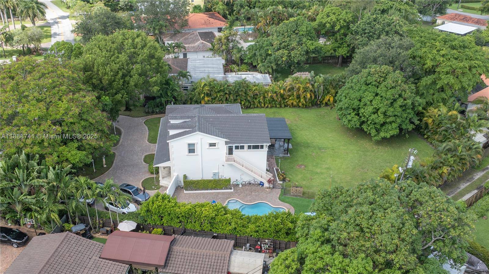 Beautifully renovated home sitting on a oversize lot in the heart of small Town Miami Springs in the premium area of the golf course.