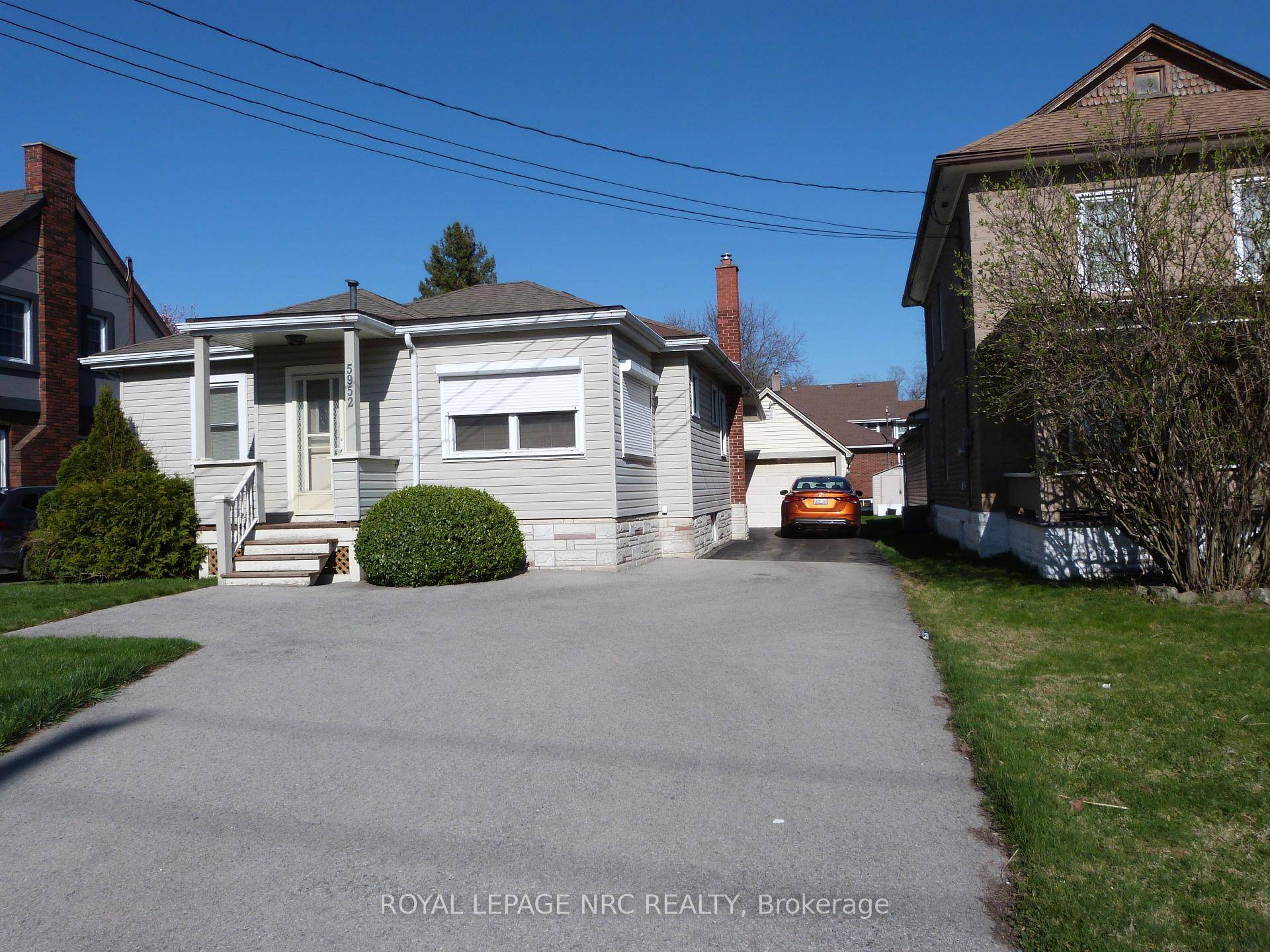 THIS 2 1 BEDROOM BUNGALOW HAS A MAINTENANCE FREE EXTERIOR WITH CUSTOM EXTERIOR CRANKING SHADES AT THE FRONT OF THE HOME.