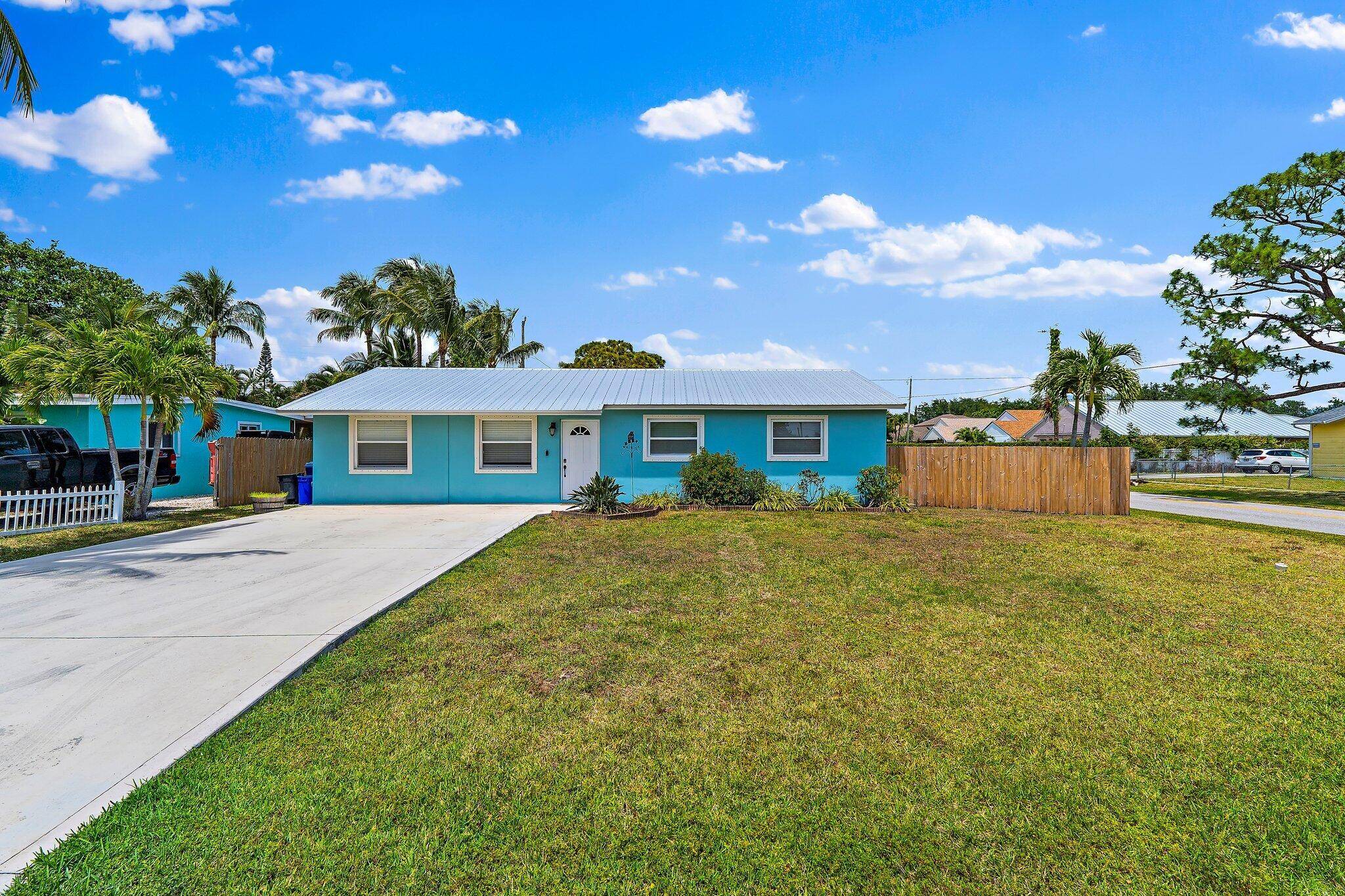 Welcome to this beautifully updated and meticulously maintained single family home, perfectly situated in the heart of Jupiter.