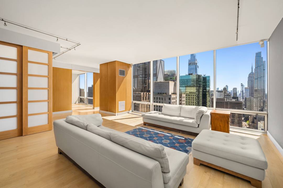 DISCOVER YOUR DREAM LOFTLIKE HOME HIGH IN THE SKY ON THE 45TH FLOOR OF THE ICONIC OLYMPIC TOWER !