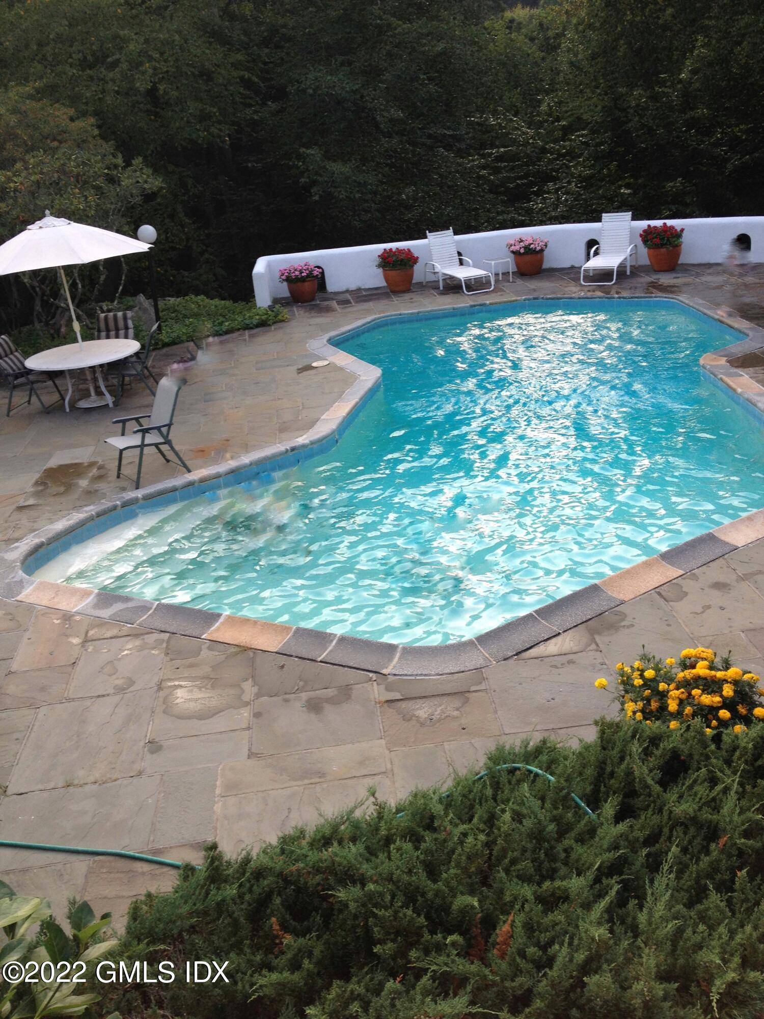 Enjoy the summer in a sunny contemporary home in the privacy of back country Greenwich.