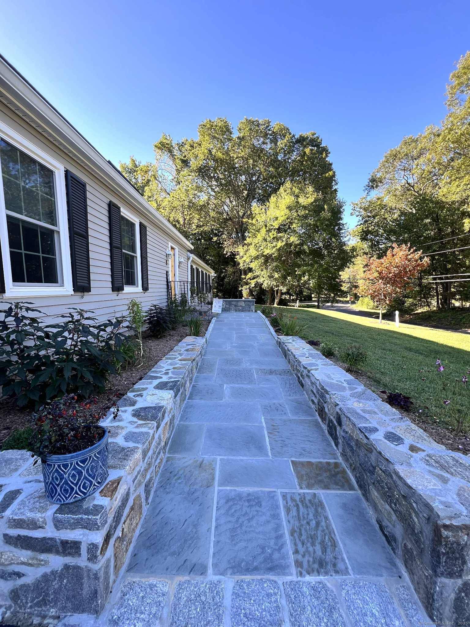 Located at the entrance of a quiet cul de sac, this expansive contemporary Cape sits on over an acre and offers 4 bedrooms and 2 full and 2 half baths.