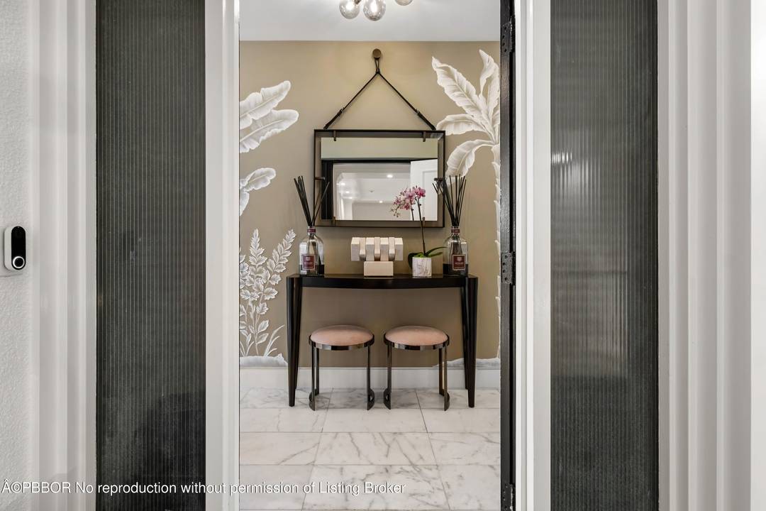 Experience the ultimate in elegance and tranquility with this newly renovated corner residence, perfectly positioned on an exclusive and secure island in Palm Beach.