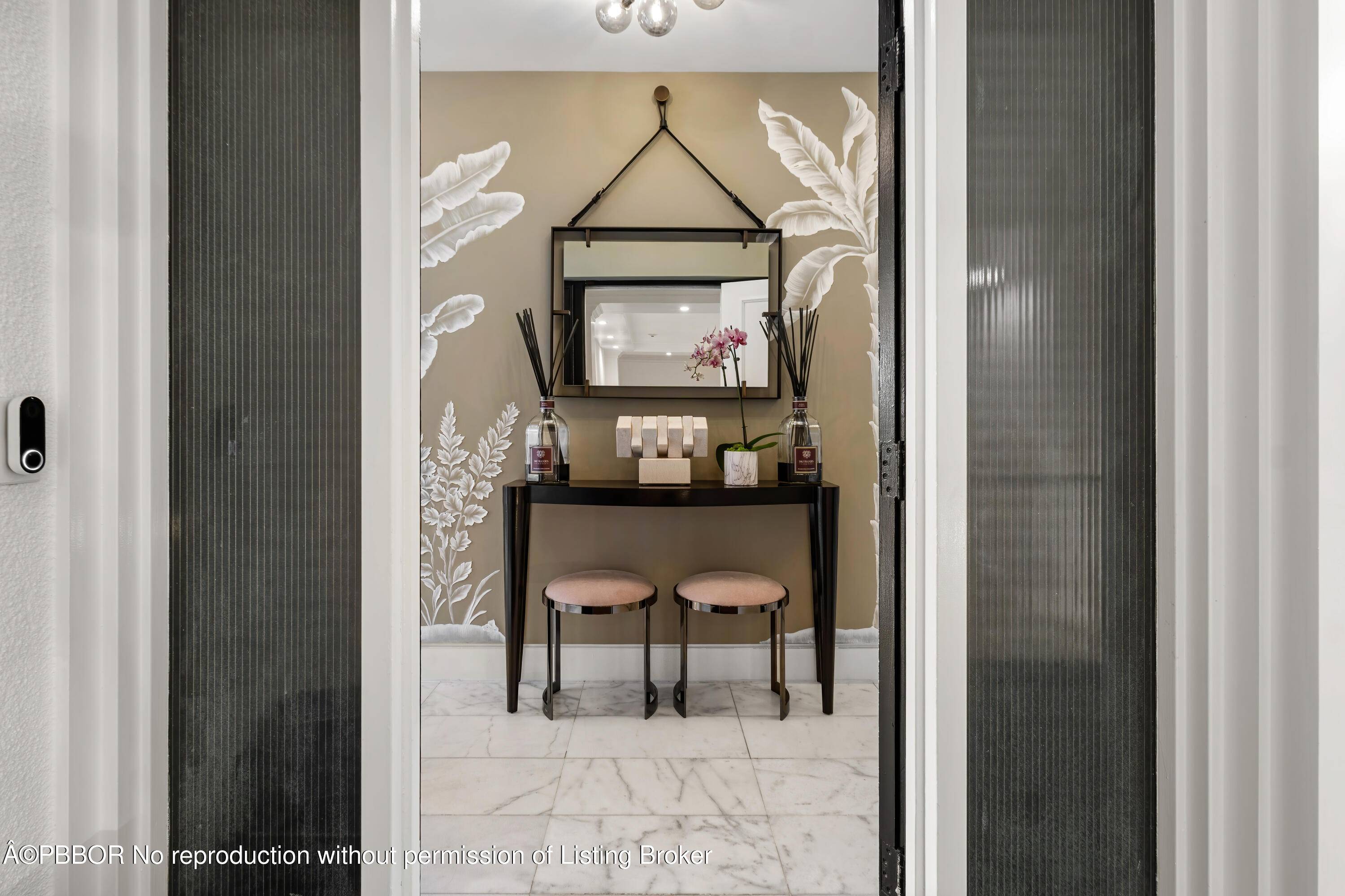 Experience the ultimate in elegance and tranquility with this newly renovated corner residence, perfectly positioned on an exclusive and secure island in Palm Beach.