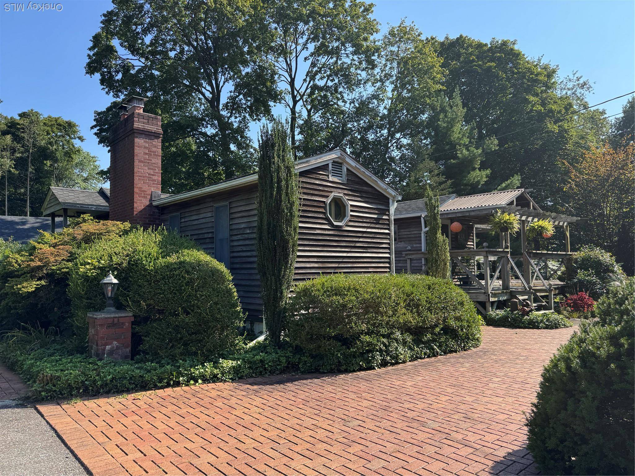 If you are looking for a charming unique craftsman style 2 bedroom home in a Secret Garden style setting, this is for you !