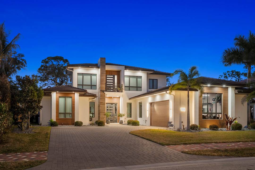 Experience modern waterfront luxury in this stunning contemporary masterpiece with impressive open floor plan and designer upgrades and finishes !