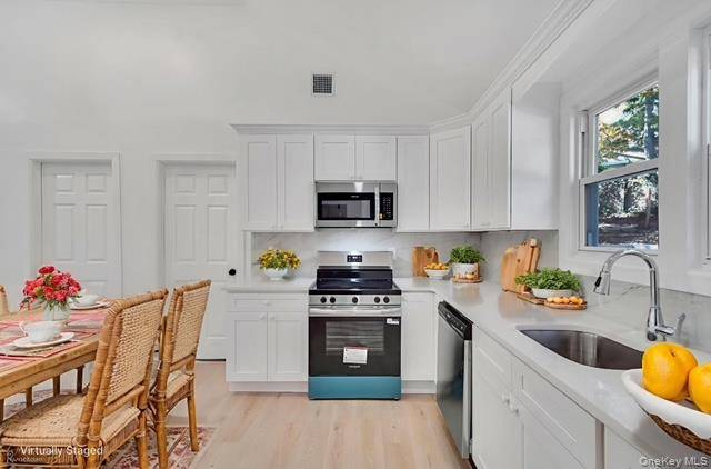 OPEN HOUSE CANCELLED SUNDAY JANUARY 18 DUE TO WEATHER Welcome to 7 Rosedale, a fully renovated 3 bedroom, 2 full bathroom ranch that blends timeless charm with contemporary style.