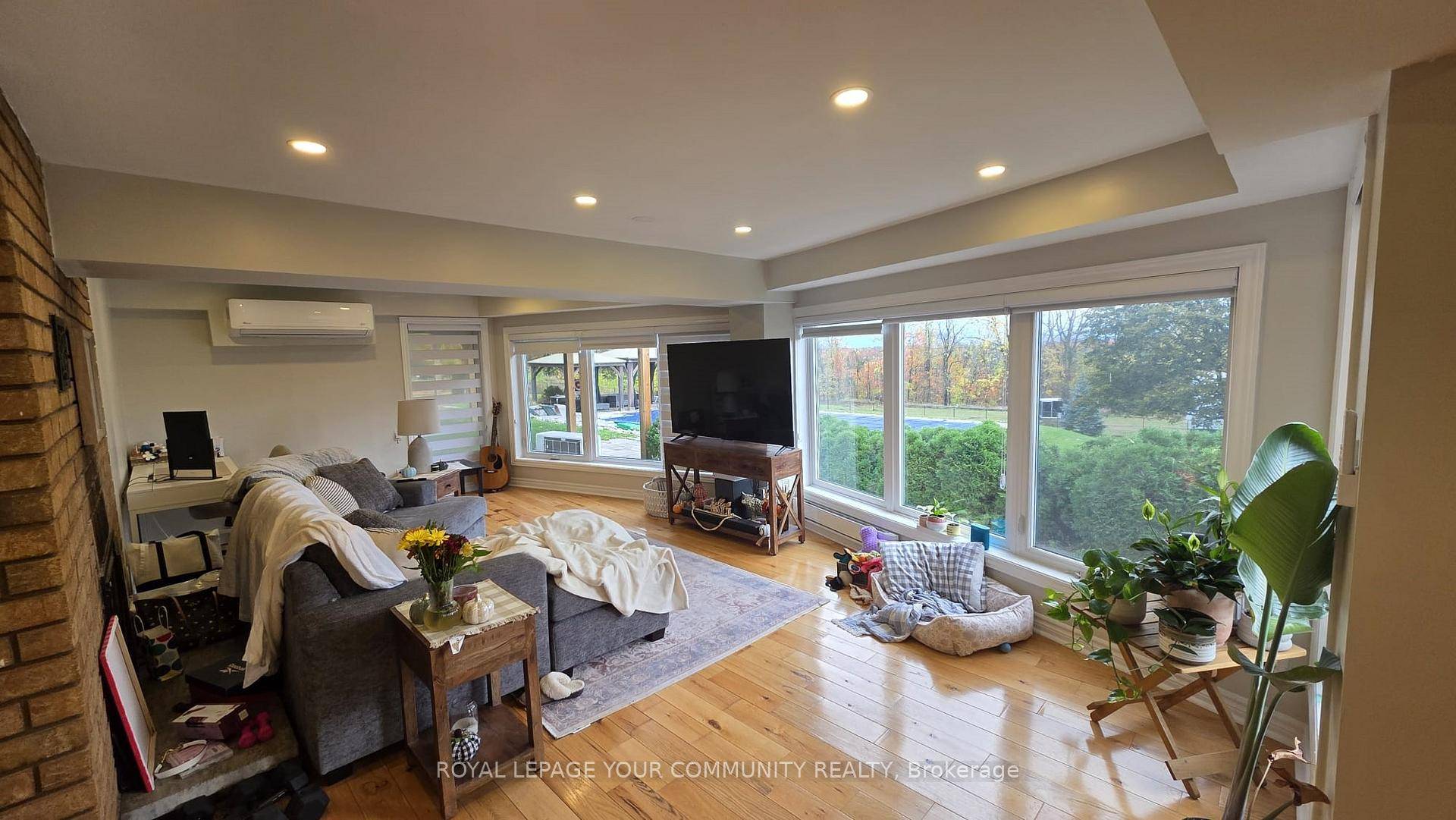 Bright walkout two bedroom basement apartment featuring large windows throughout, offering plenty of natural light.