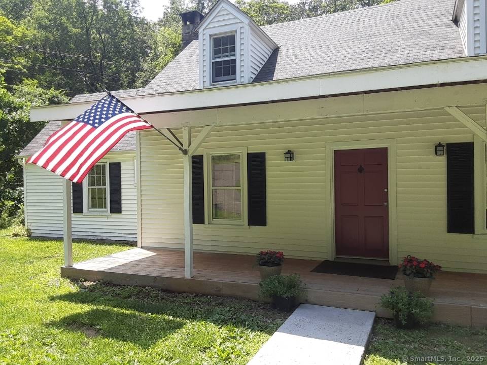 Cozy charm of a vintage three bedroom, two full bath home on nearly three acres !