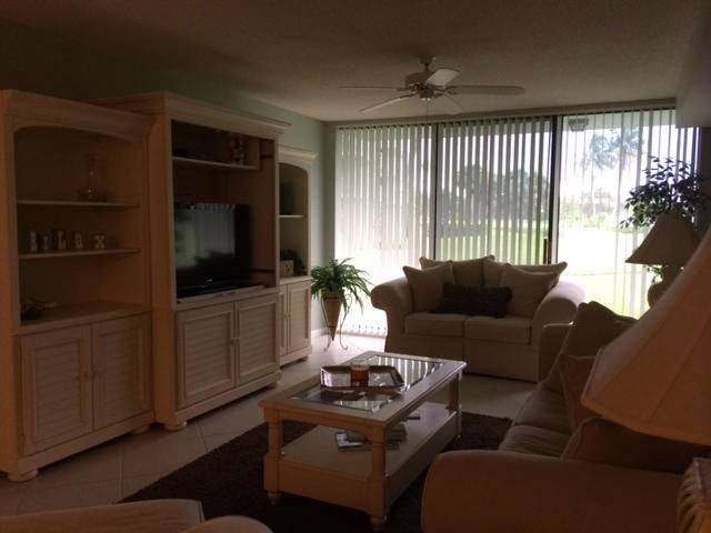 First floor unit with view of garden and clubhouse.