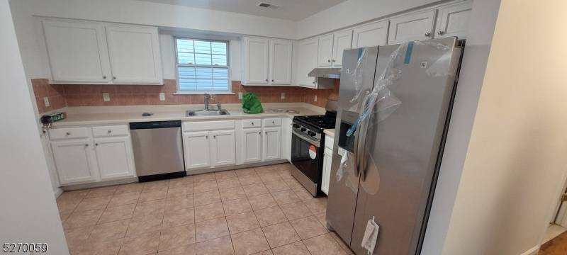 3 large units, 8 bedrooms, 5 1 2 bathrooms, laundry room in each apt, forced air, wood floor, new appliances, 2 car garage, Pictures taken before tenants moved in.