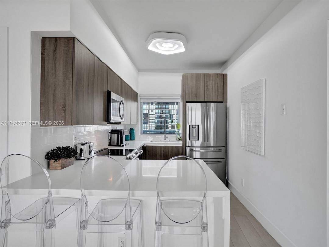 Immaculate and impeccably maintained 2 bedroom, 2 bath residence showcasing breathtaking bay and sunrise views.