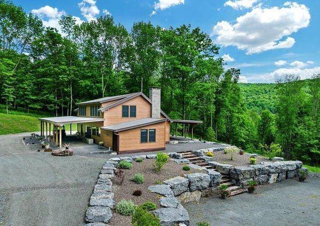 Private 61 Acre Retreat Custom Contemporary Home Escape to this serene 61 acre property, reached by a private bridge and featuring a custom 3 bed, 2 bath contemporary home.