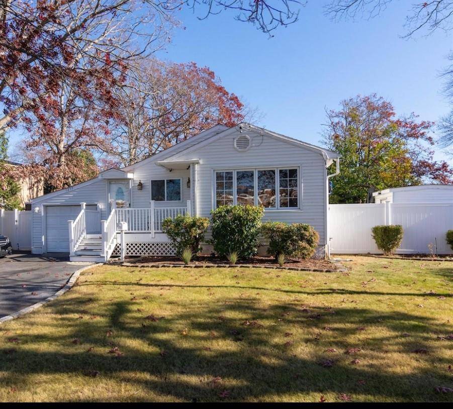 Welcome to 1255 Udall Road in Bay Shore a stylish and move in ready 3 bedroom, 1.