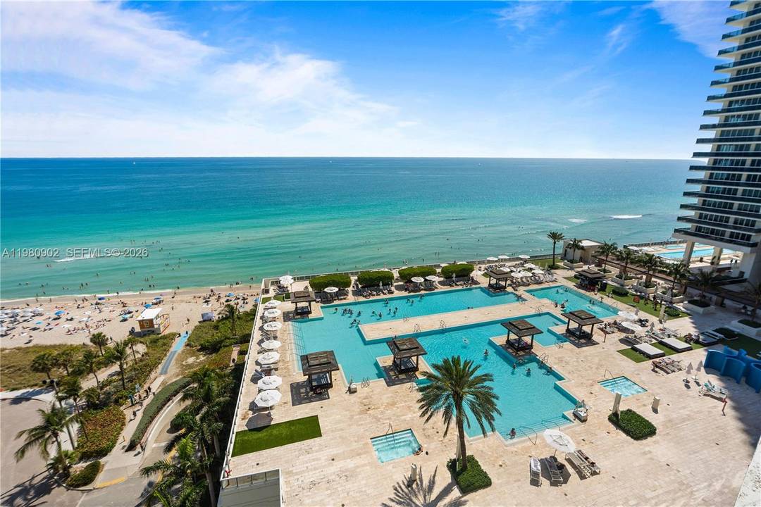 Stunning large corner residence with breathtaking direct ocean views in the prestigious Beach Club community.
