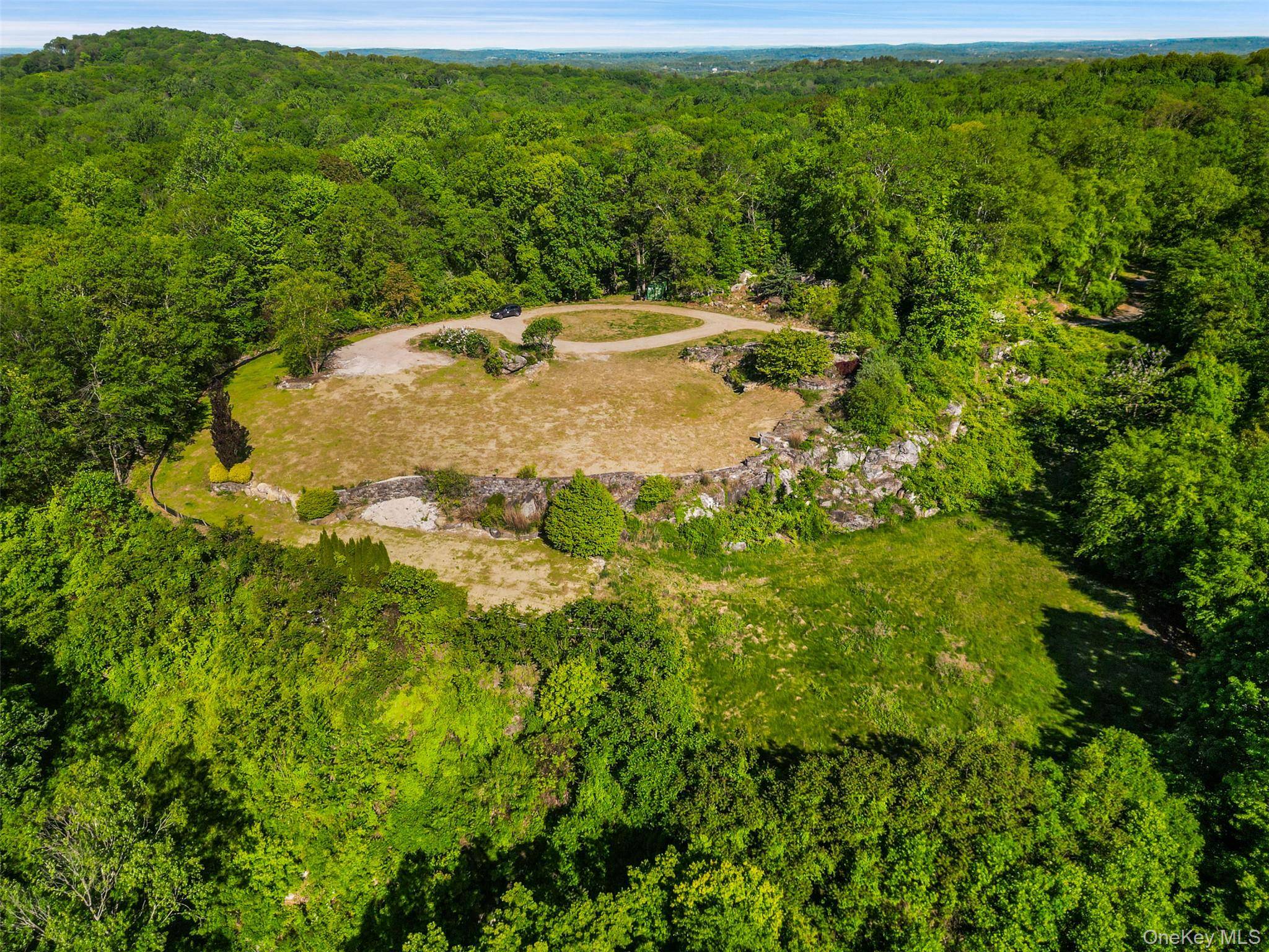 A rare and exceptional opportunity to build your dream home, with distant views, on 33 private acres.