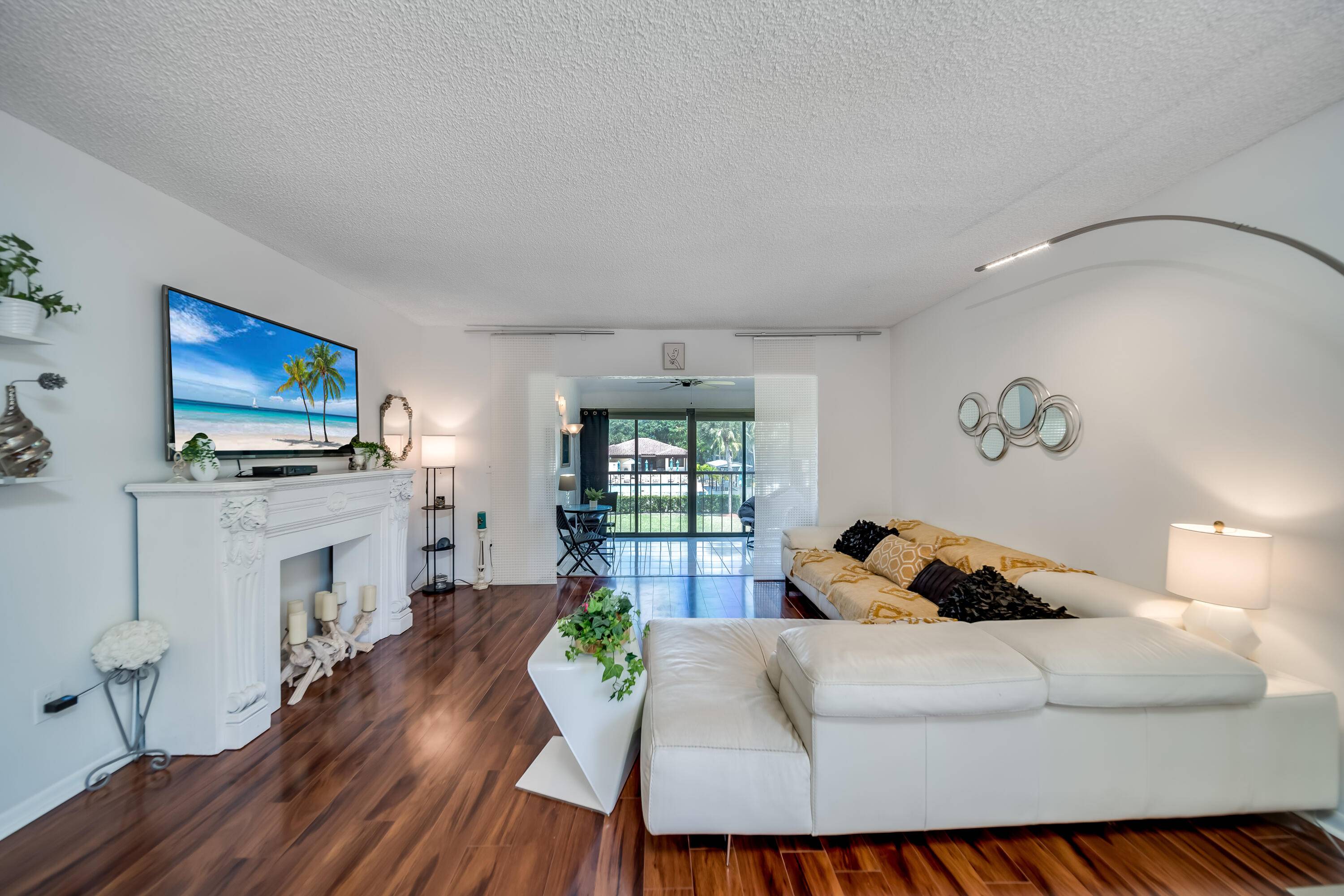 Welcome to this cozy 2 bedroom 2 bathroom corner unit with a private entrance, nestled in the heart of Boca Lago Country Club, where membership is optional.