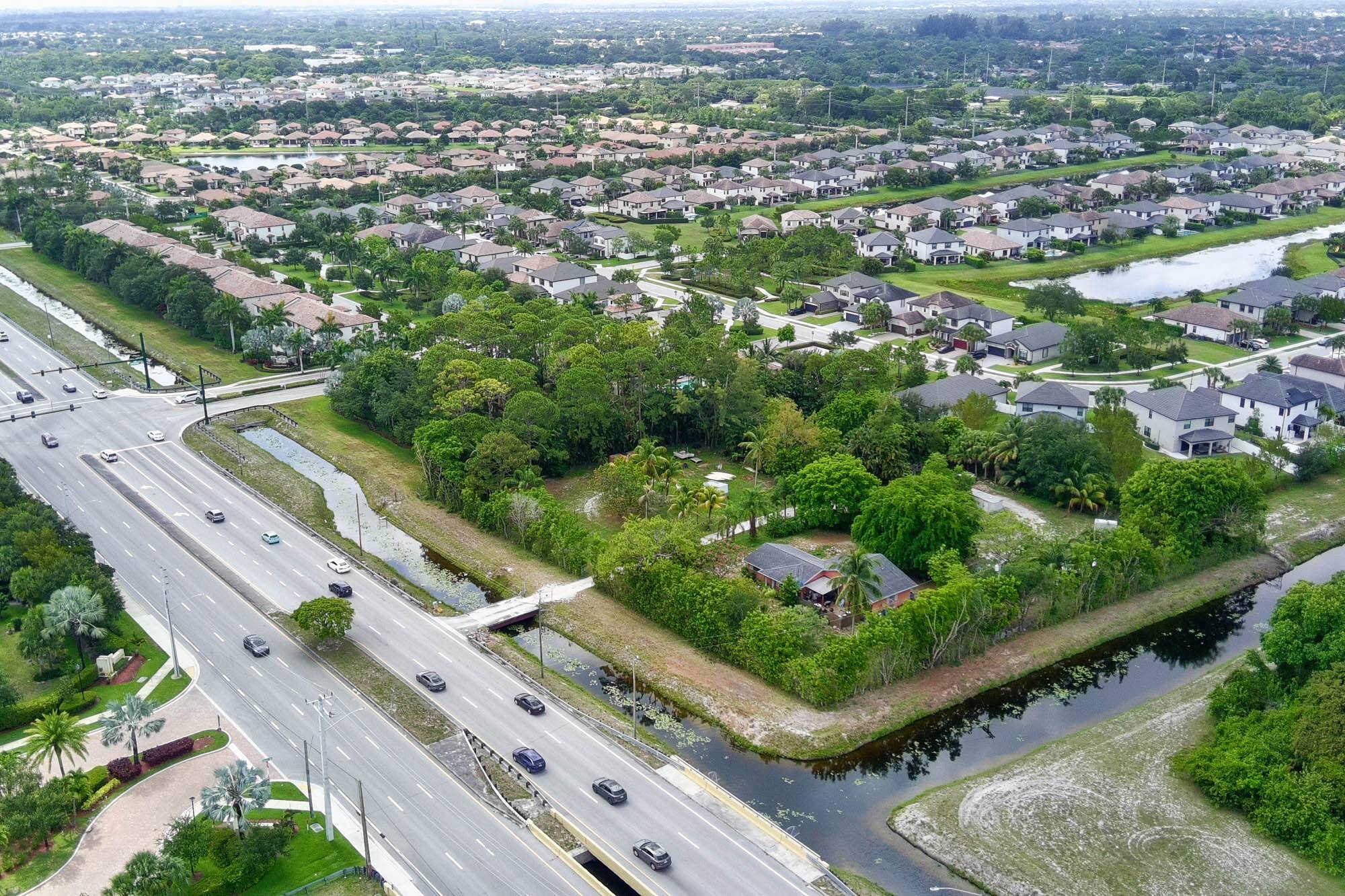 Welcome to Hypoluxo Ranch, an exceptional opportunity offering over 2 acres of land on a prime corner lot along Hypoluxo Road.
