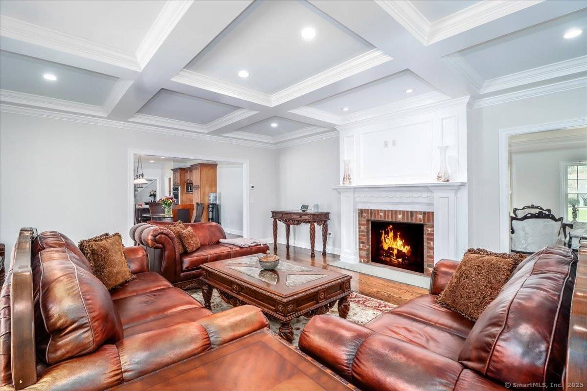 A slate walkway leads to a covered portico, setting the tone for this exquisite home on 2 private acres.