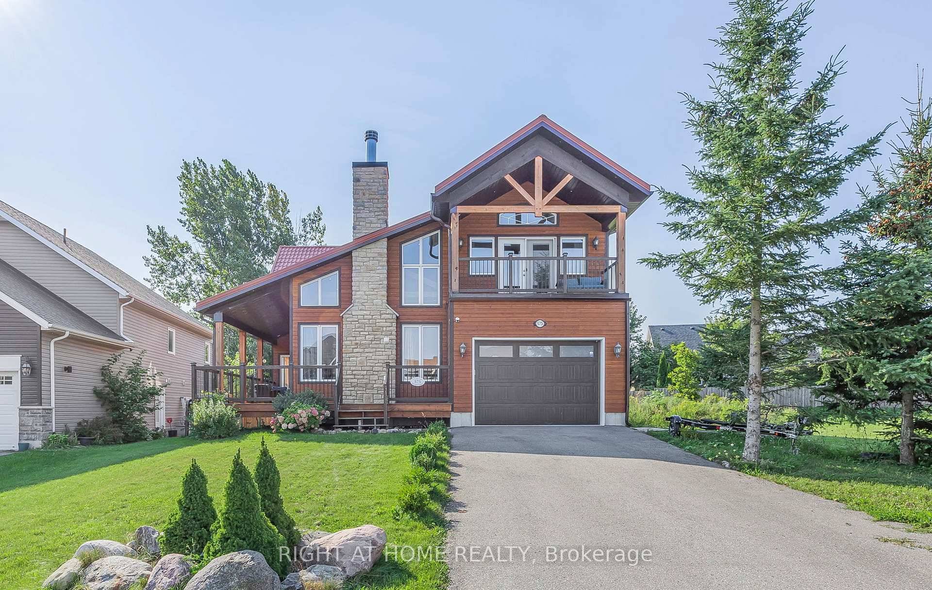 Step into this bright, custom designed home where soaring vaulted ceilings and an open layout create an inviting sense of space.