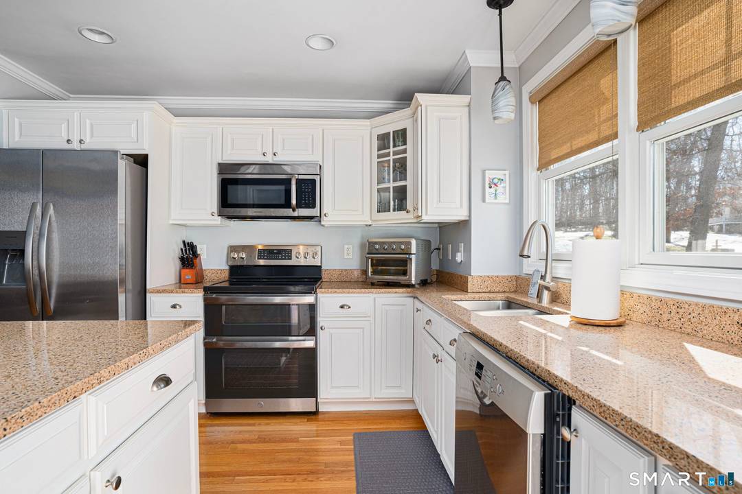 3 bedrooms, 2 bathrooms, and a 1 car under garage make this beautifully maintained Woods Walk townhouse both functional and move in ready.