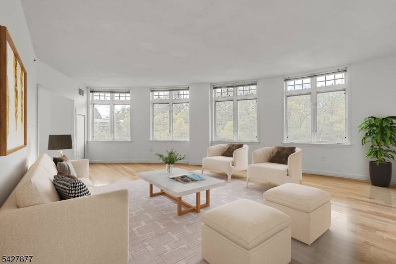 This sought after 2 bedroom 2 bathroom west facing 1410sf E line features incredible light through its open living dining floor plan, unique curved architecture presents an expansive wall of ...