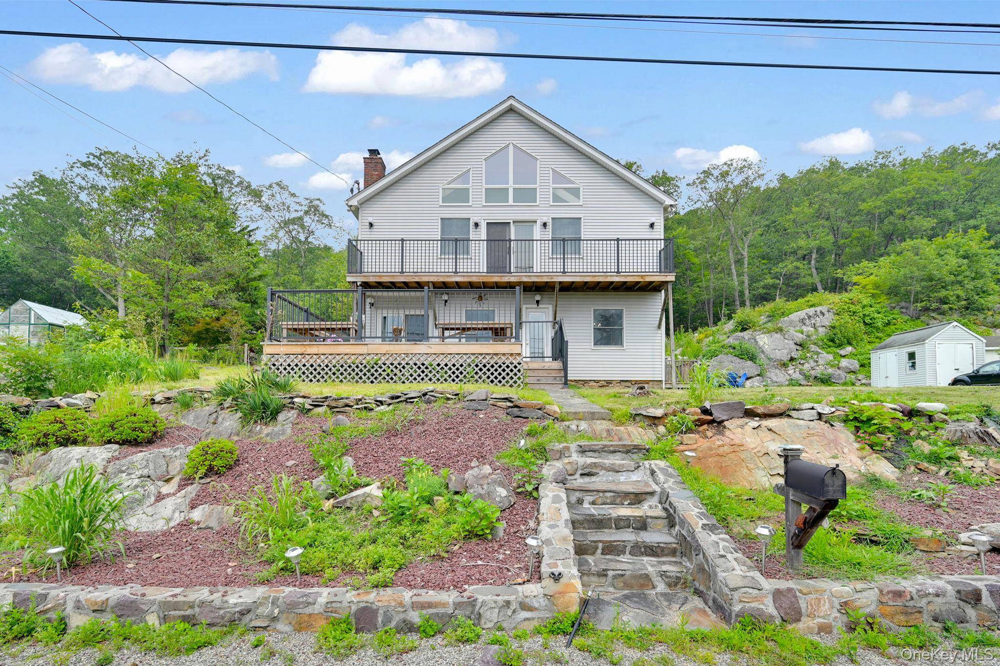 Welcome to 47 Blueberry Hill, a spacious and light filled home nestled in the desirable Furnace Brook community of Greenwood Lake where lake life, privacy, and natural beauty come together.