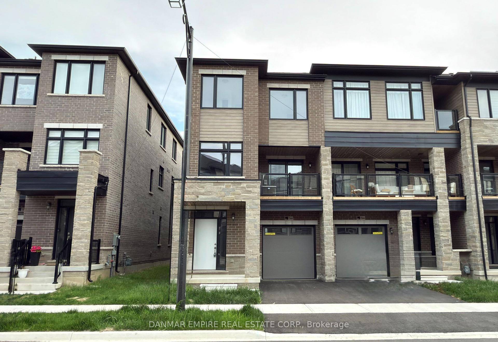 This stunning end unit newly built townhome in the heart of Milton is 100 Freehold and offers the perfect blend of modern luxury and comfort.
