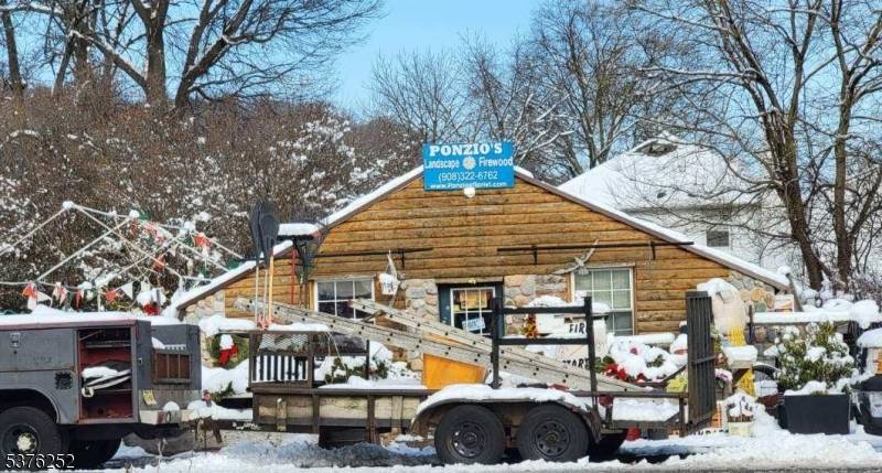 The property consists of a 2 story house and a greenhouse.