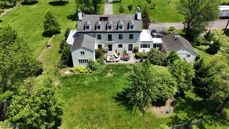 Timeless 1920's residence on 13 acres with approved one bedroom apartment and subdivision potential !