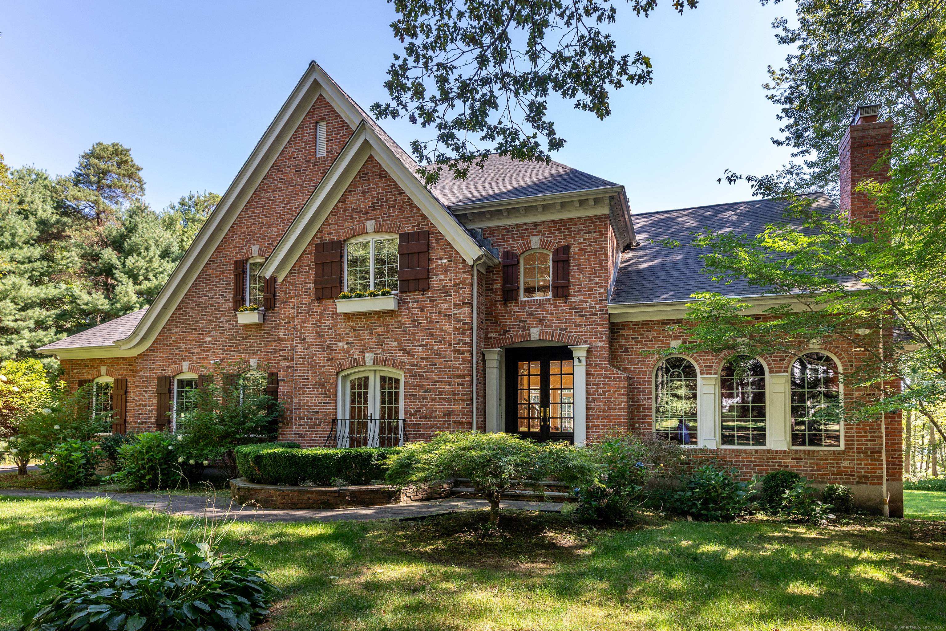 Tucked away in a beautifully maintained cul de sac, this stately brick French Provincial home enjoys a private, direct waterfront setting on Bull Pond, bordered by 70 acres of protected ...