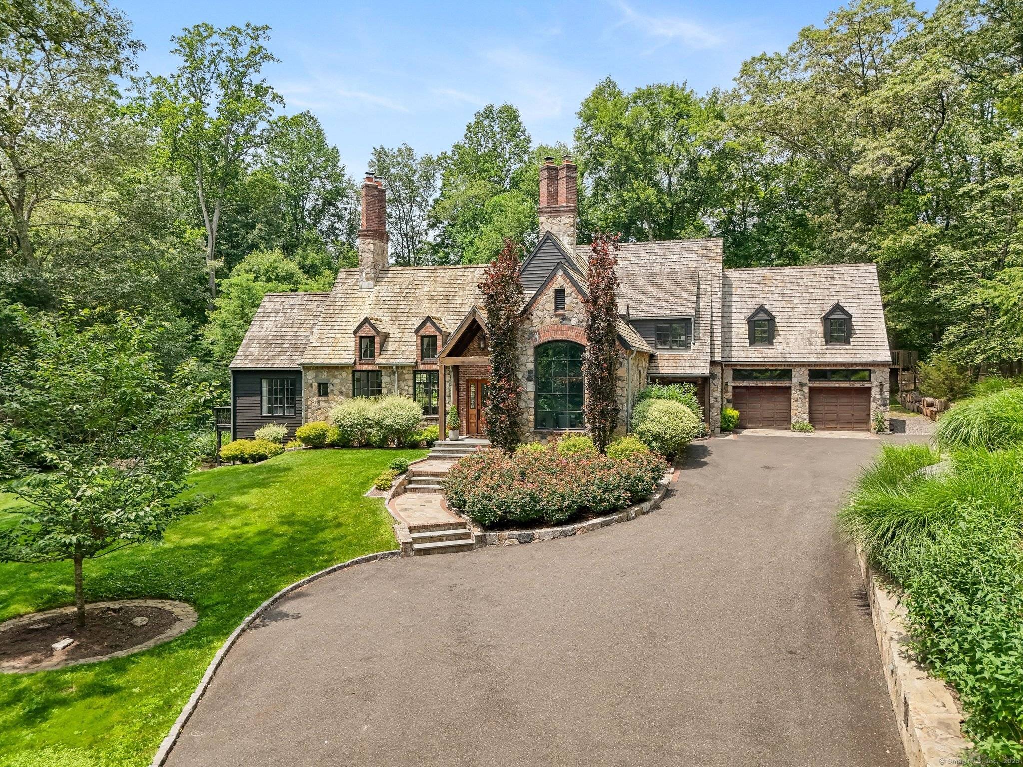 Tucked at the end of a long, private drive in a serene park like setting near the storybook village and golf course of Pound Ridge this European inspired stone cedar ...