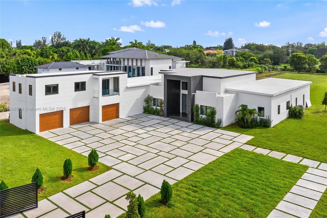 Discover a brand new modern masterpiece in the prestigious enclave of Southwest Ranches nestled within Rolling Oaks.