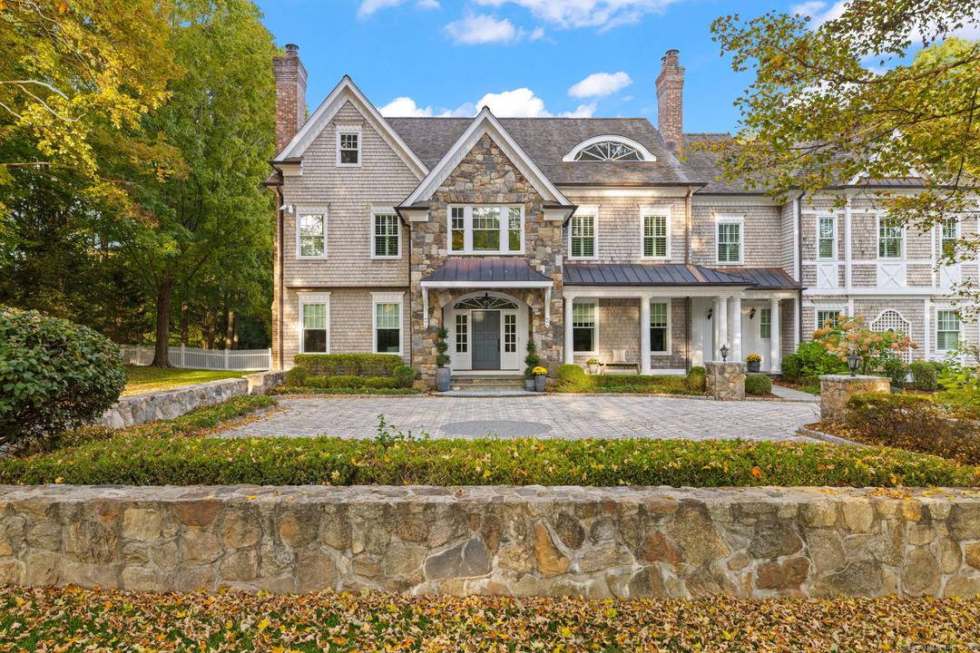 Featured on 12 News CT and built by renowned master builder John Heggland, this exceptional 7, 811 sq ft Georgian Colonial estate is gracefully sited on 2.