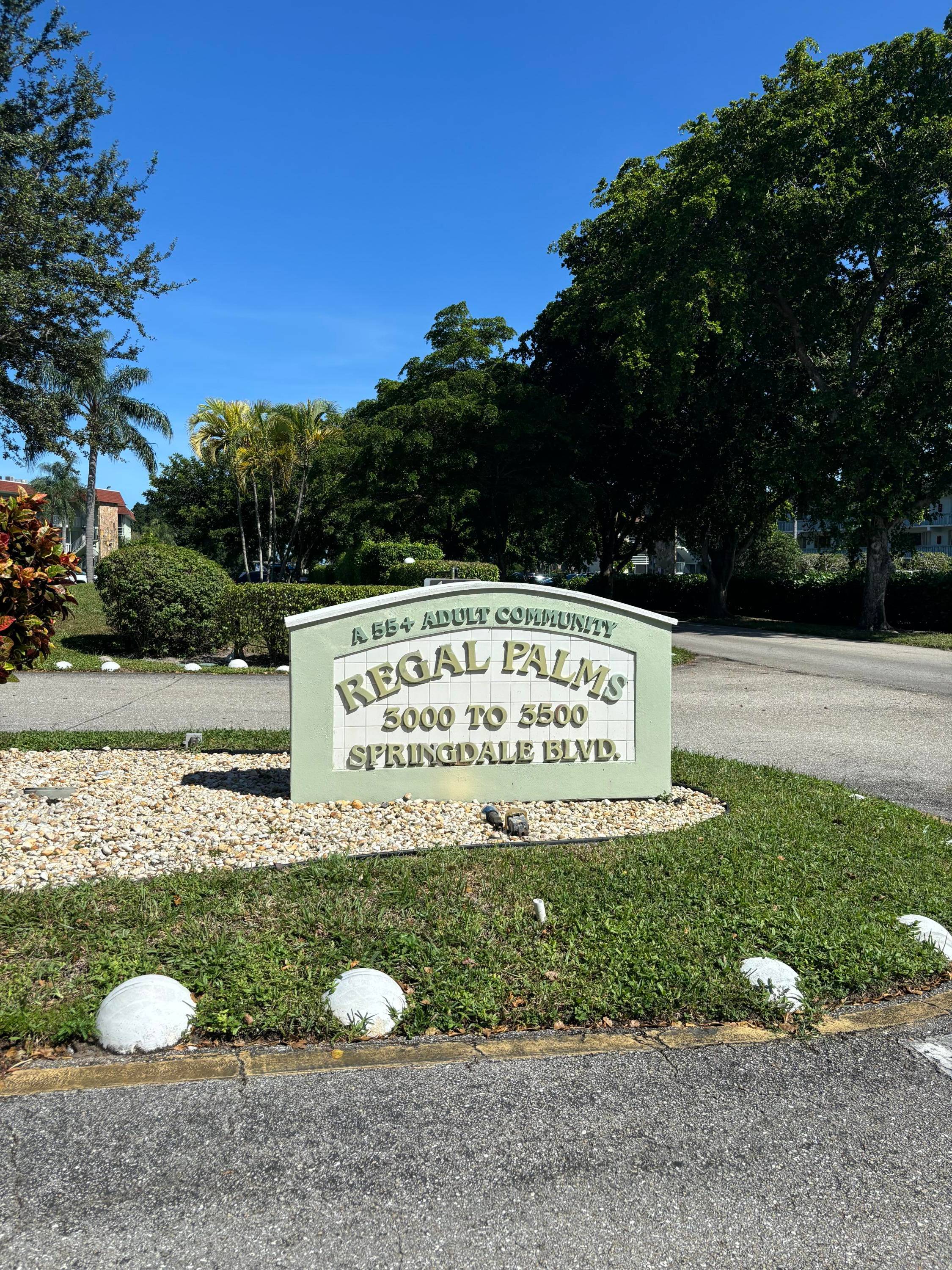 Beautiful second floor end unit in the desirable 55 community of Regal Palms.