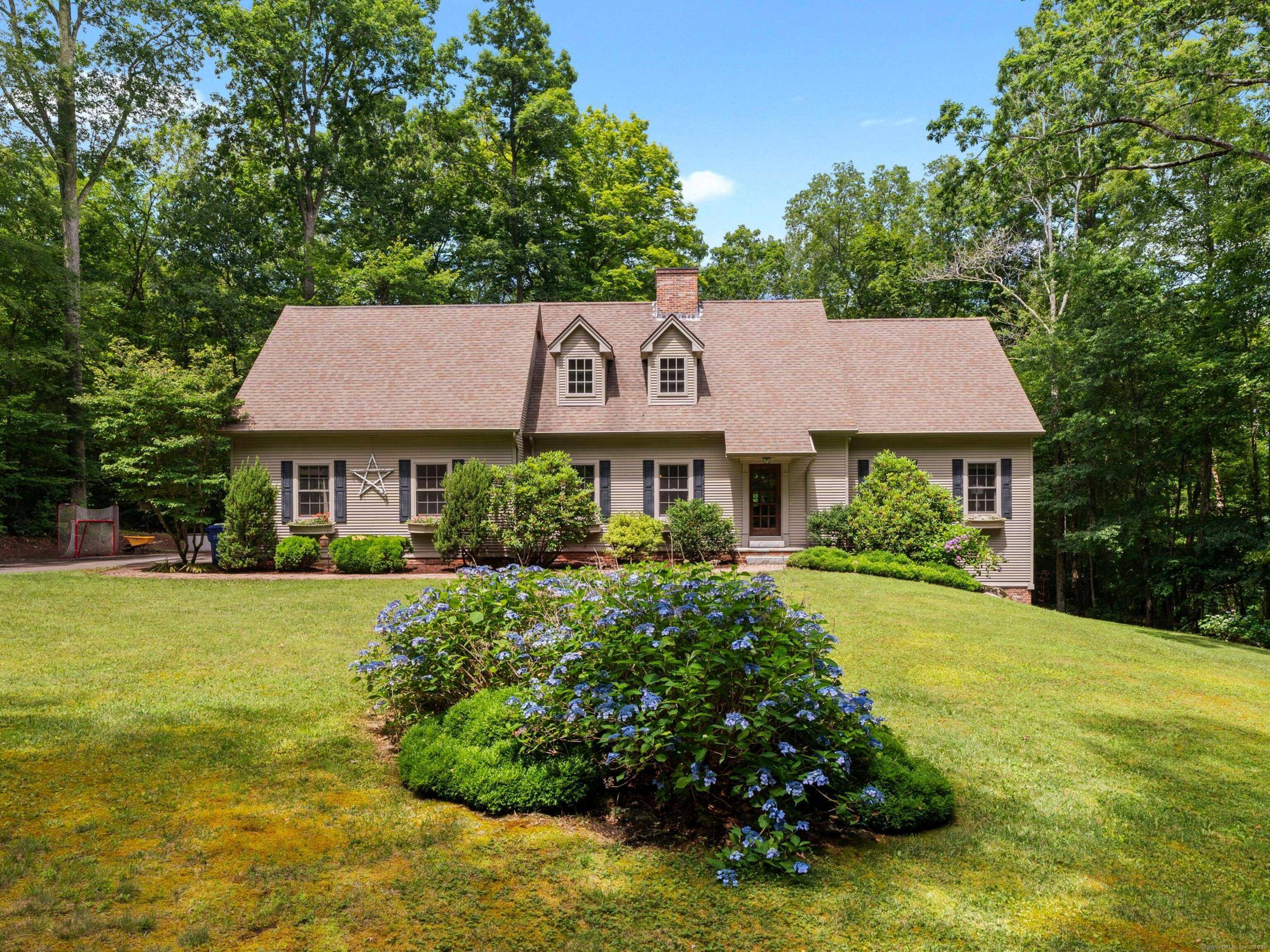 Discover the perfect blend of elegance and convenience in this custom Cape Cod home, nestled privately in Chester, CT.